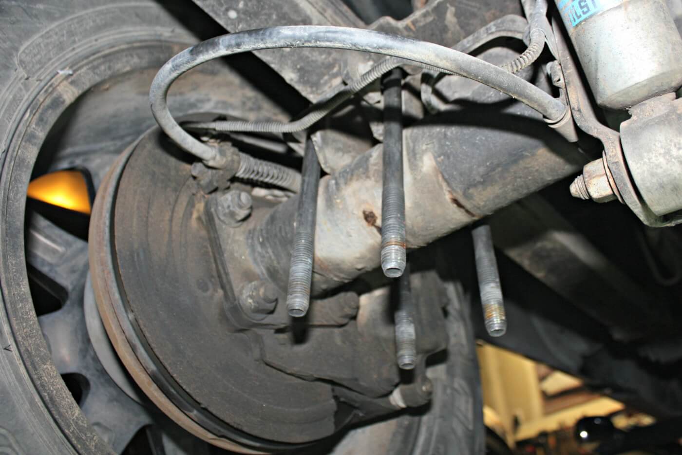 3. The first step to the install is removing the factory axle U-bolt nuts and washers. The Longhorn axle bracket will bolt-up using the factory U-bolts and hardware; you’ll simply slide the new bracket onto the U-bolts below the lower axle clamp plate.