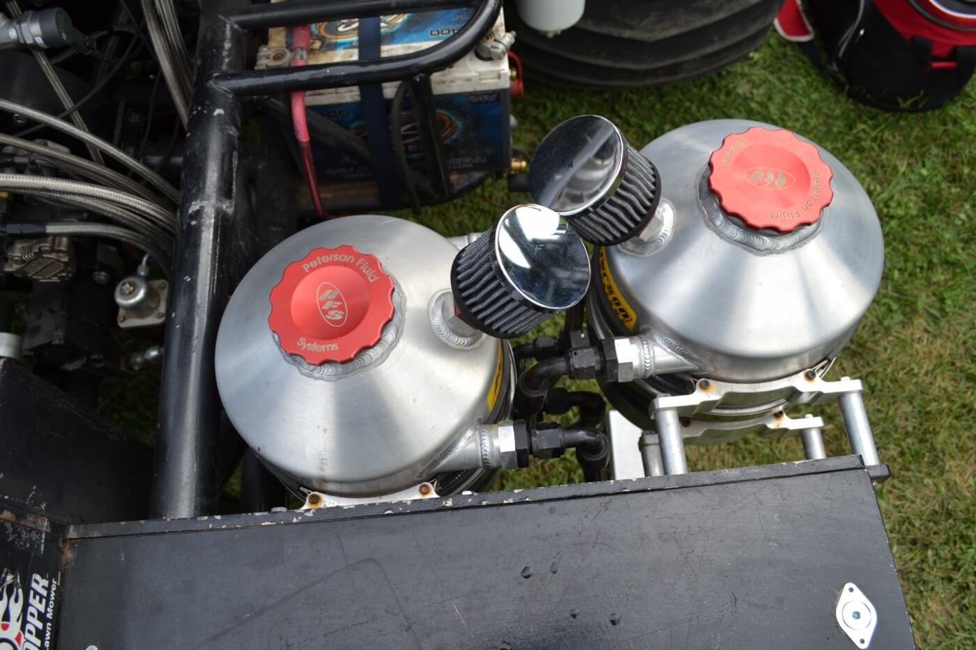 The oiling system for the Duramax system is quite complex, and uses an external wet sump system. Up front, four Peterson tanks (two on each side) hold oil for both the engine and turbo systems, as well as diesel fuel, and water for the water injection system. 