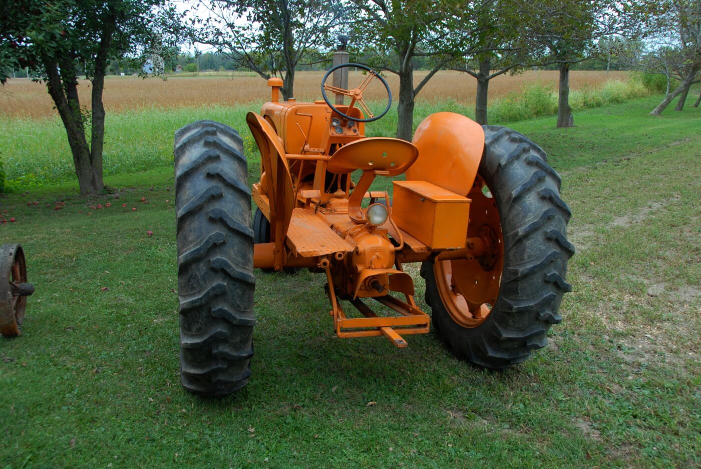 The working end shows a swinging drawbar and the rear PTO. A 3-point hydraulic hitch was optional and all hookups were universal so that a variety of implements could be used.