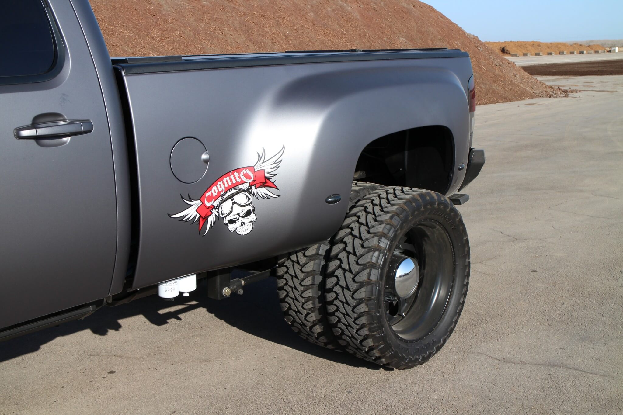 The main emphasis of the build was to convert a Silverado standard bed into a dually. A dually rear differential complete with 3500 series brakes was purchased from the Internet. Four American Force Weapon matte black dually wheels and Toyo Open Country M/T tires contribute to the aggressive off-road appearance. 