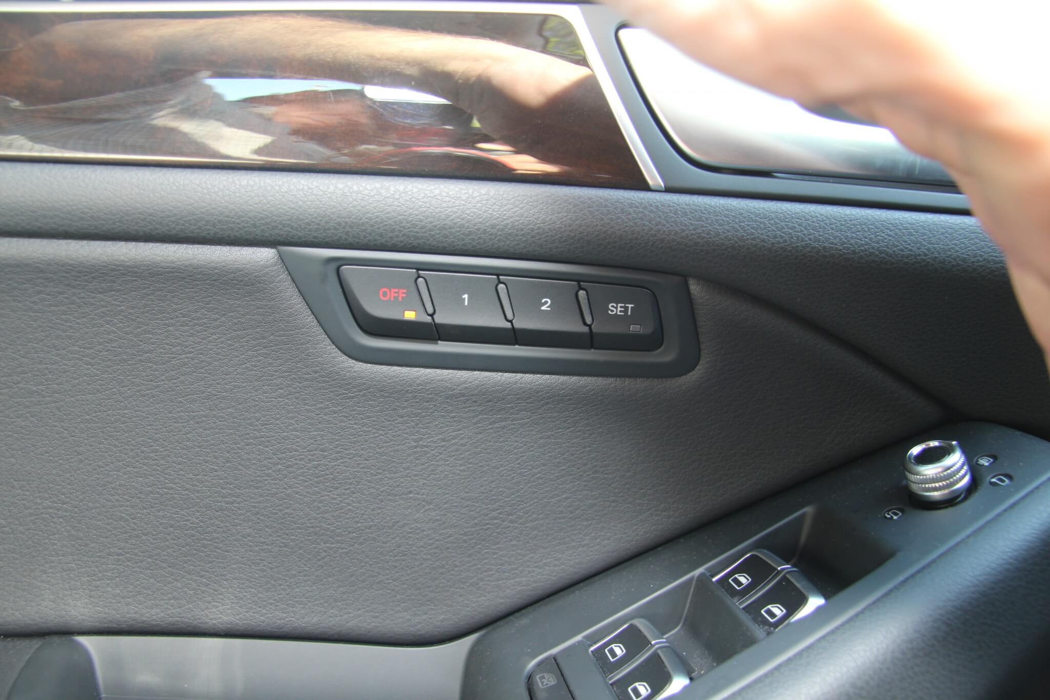 Here you see the automatic seat position buttons. His and her seat presets are becoming common and we love them. 