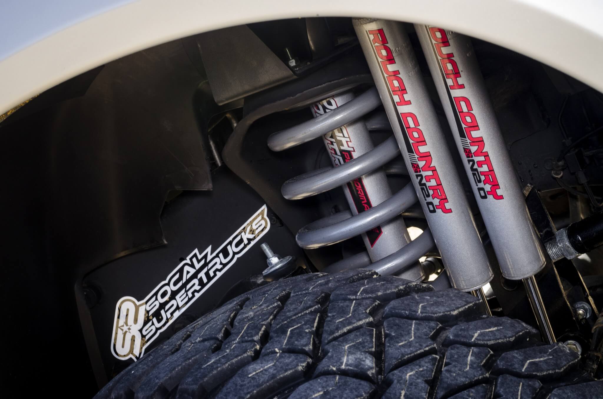 Triple N2.2 performance shocks from Rough Country control the front suspension.