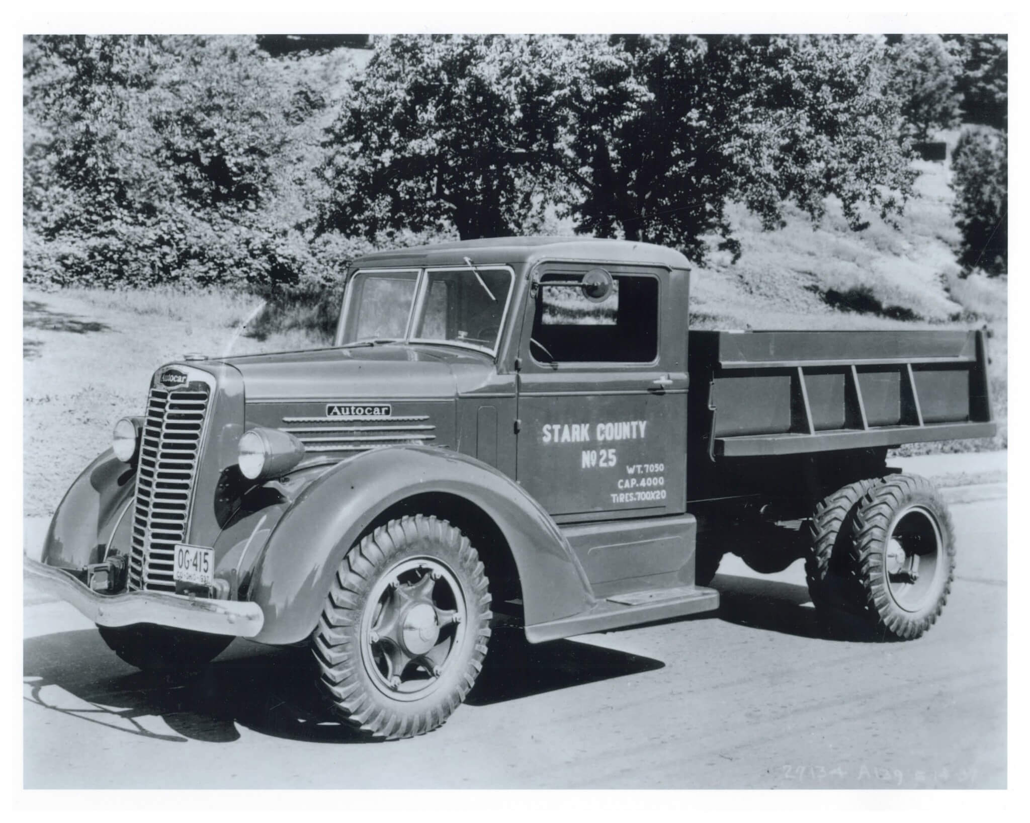 The 1930s found truck makers following the styling lead of their automotive cousins. Note the unique front end styling cab treatment on this county-operated Autocar medium-duty dumptruck.