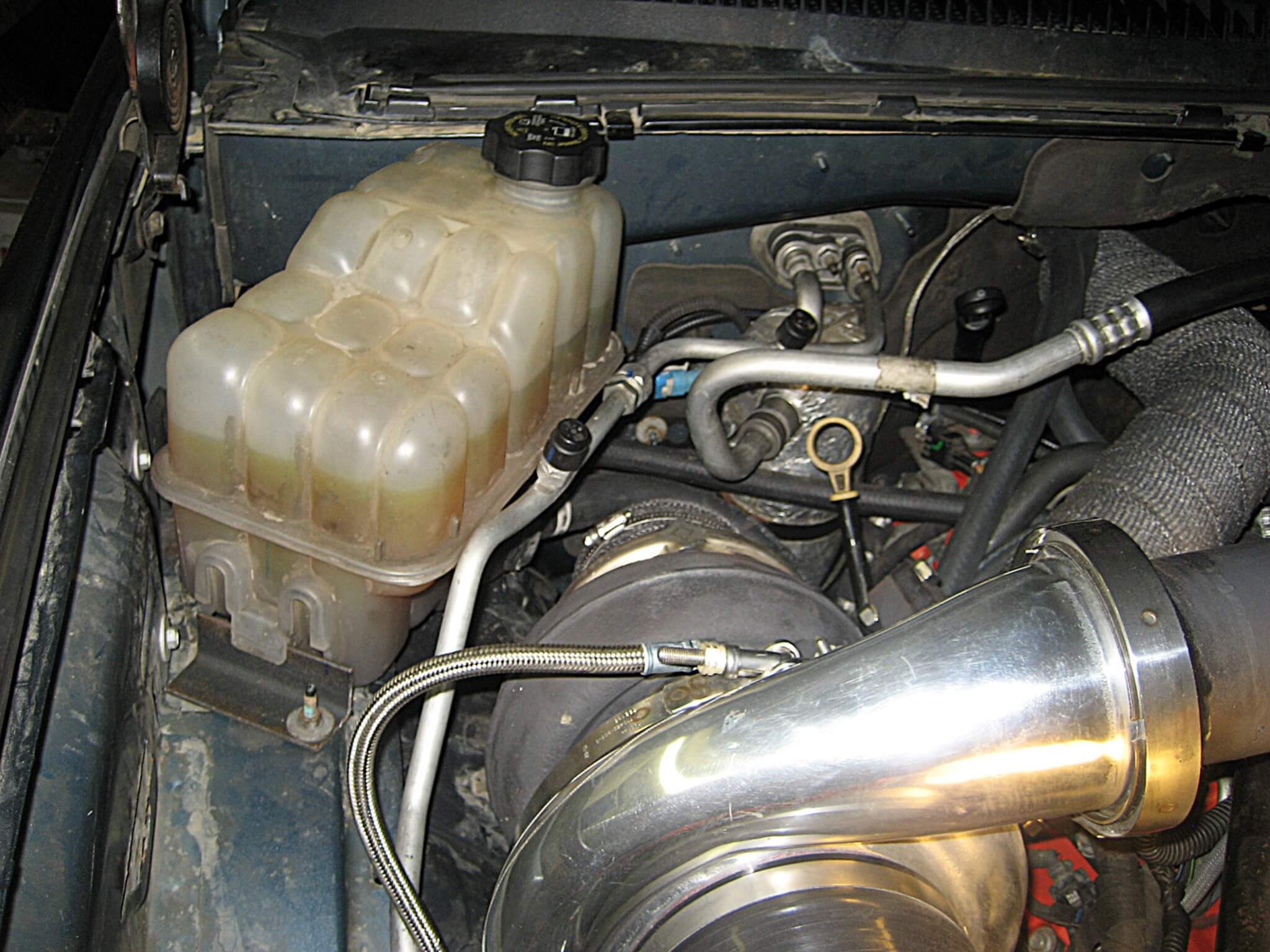 2. This Duramax-equipped truck was upgraded to a dual-turbo setup. Unfortunately, this required the second battery to be eliminated to make room for the coolant bottle. The result is less reserve capacity for low rpm running. A better alternator was a must for this owner to offset the single battery disadvantage. 