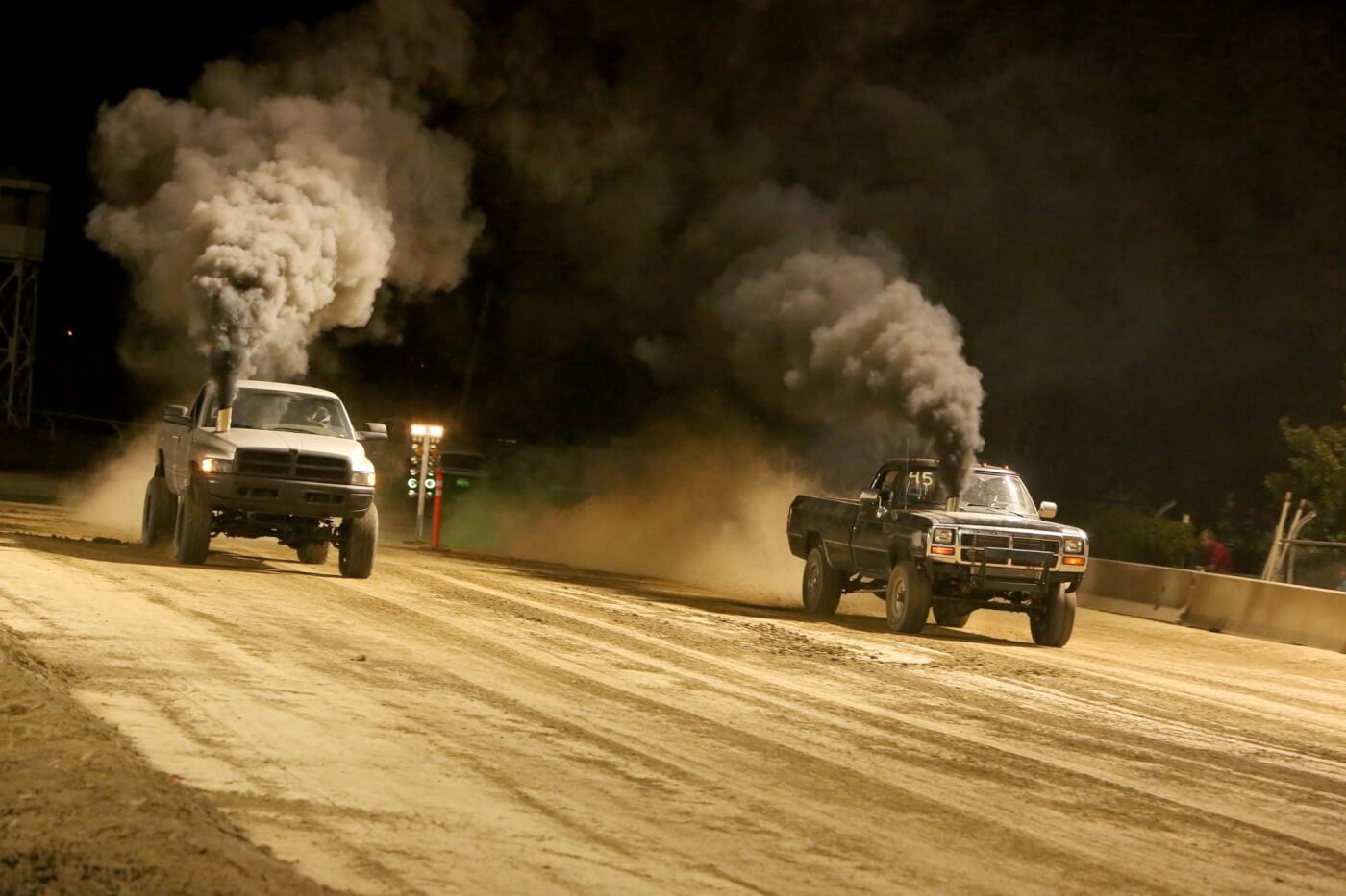 The dirt drags ran late into the night and made for a great show for the crowd. These two big Cummins trucks may not be completely street legal thanks to those awesome hood stacks, but that won’t keep them from having some fun off-road.