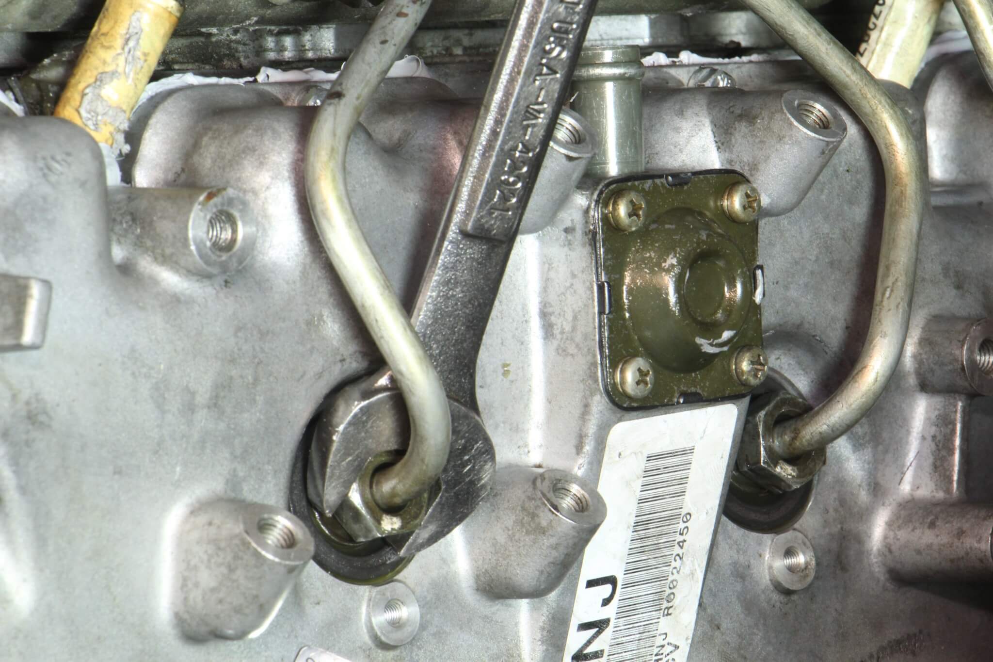 22. A 19mm open wrench was used to snug up and tighten the fuel line fittings. Always start tightening the fuel line from the injector side first, and then the fuel rail fittings.
