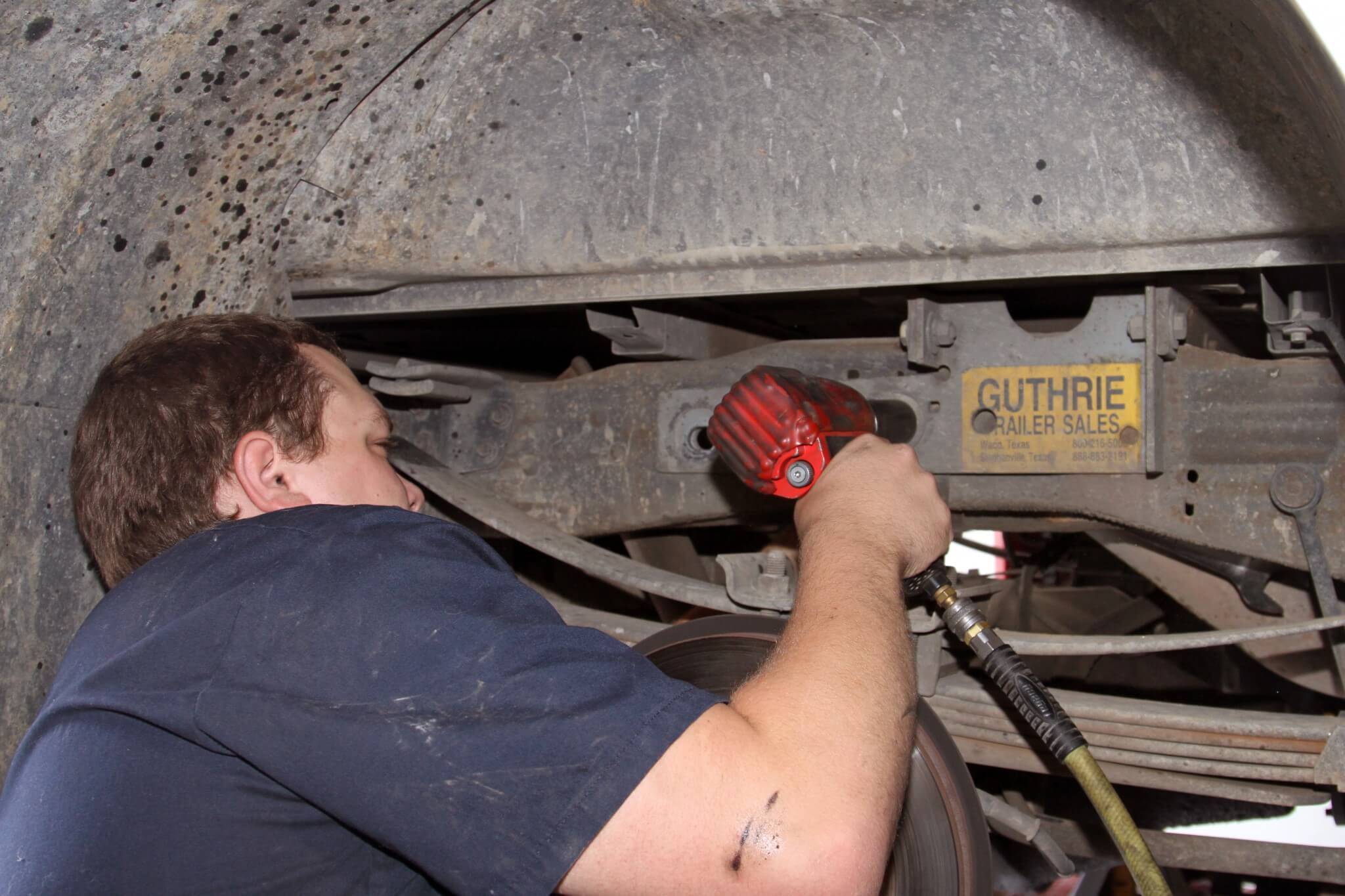 2. The kit Swamp's installed is designed to work with the B&W gooseneck mount that Uriah's truck already had installed. Here C.J. Carter removes the large 3/4-in. mounting hardware before modifying the B&W mounting plate and installing the Air Lift brackets.