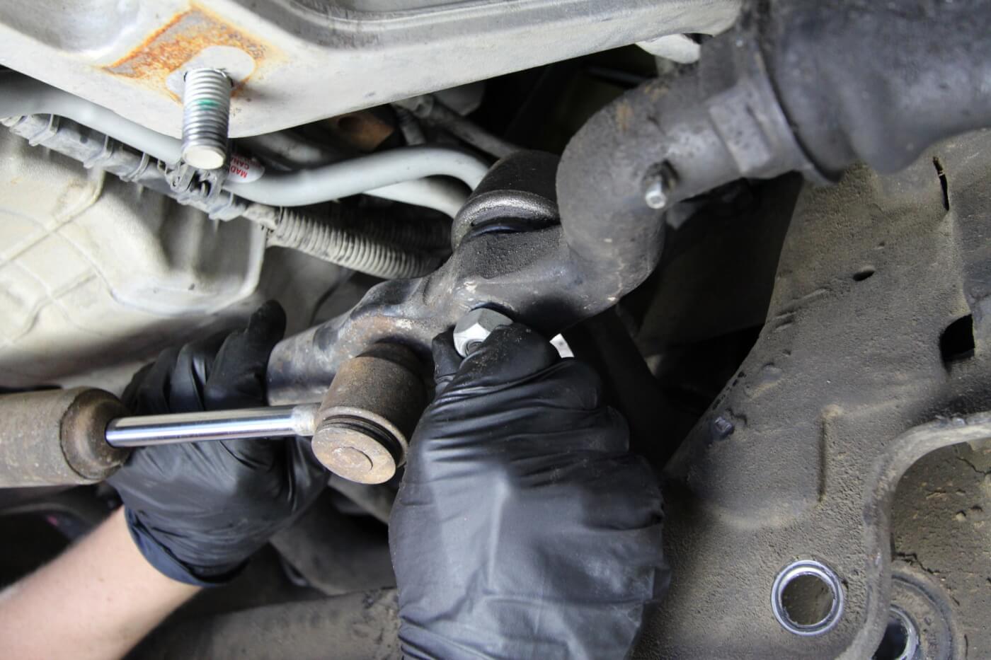 5. The center link is connected to the pitman arm on the driver’s side of the truck. The steering stabilizer is also bolted to the center link on this side. 