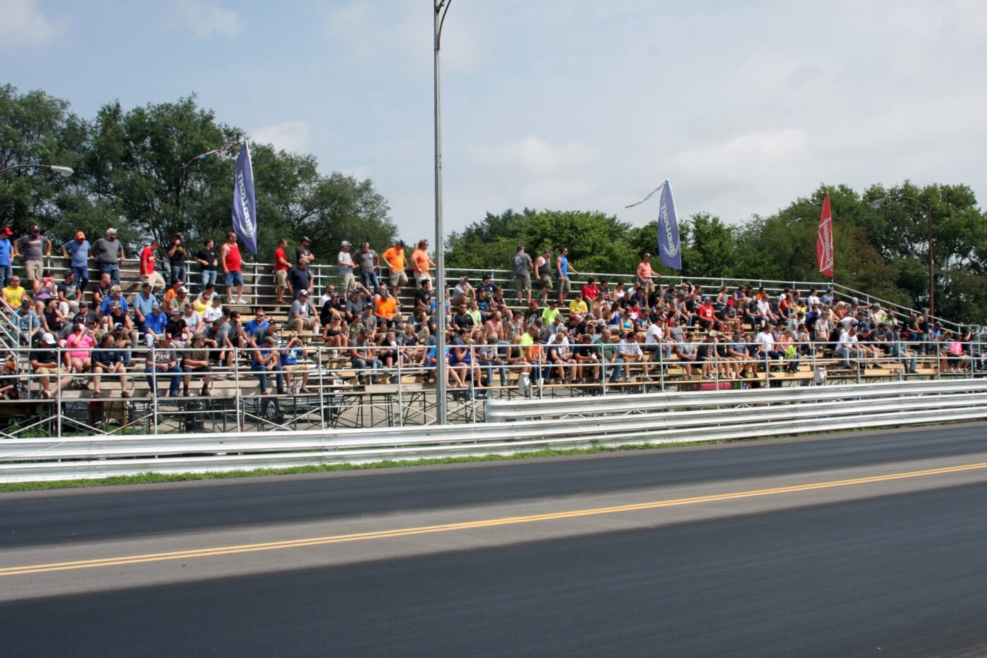 Even with the hot temperatures and no covering for the grandstands at the Crossroads Dragway, diesel enthusiasts filled the seats to catch the diesel drag racing action.