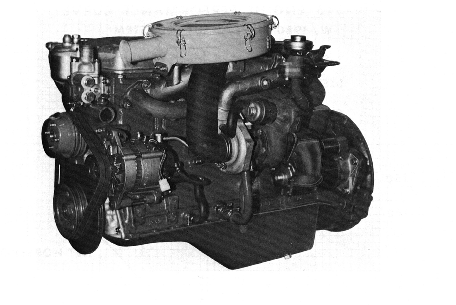 SPECIFICATIONS: SD-33T DISPLACEMENT: 198 cid (3,246 cc) BORE & STROKE: 3.27x3.94 in. POWER: 101 hp @ 3,800 rpm TORQUE: 175 lb-ft @ 2,200 rpm COMPRESSION RATIO: 20.8:1 MAX BOOST: 6.5 psi ENGINE WEIGHT: 676 lbs INJECTION PUMP: Diesel Kiki, CTS-2790 (Bosch License) INJECTOR OPENING: 1,607 psi