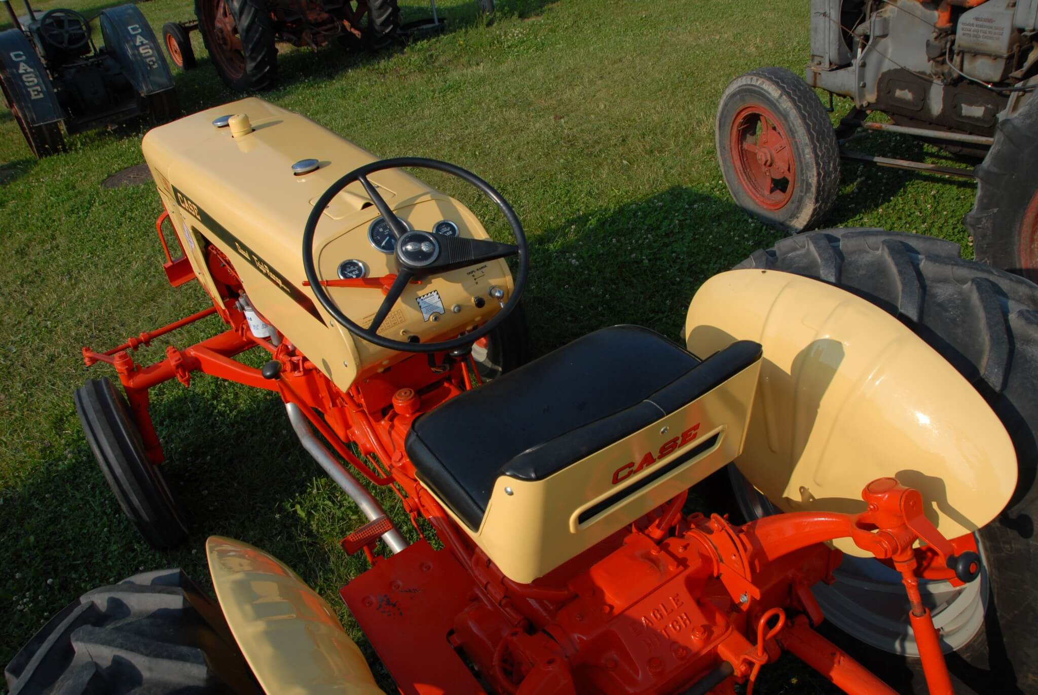 There was nothing particularly impressive about the 430's seating arrangement. The seat was a little better than most but without a substantial back. The controls were well positioned, though. Note the hand clutch, the long lever to the left of the steering wheel. In the rearward position, the transmission was disengaged but the PTO retained power flow. This enables the tractor to be stopped without interrupting power to PTO-driven implements.