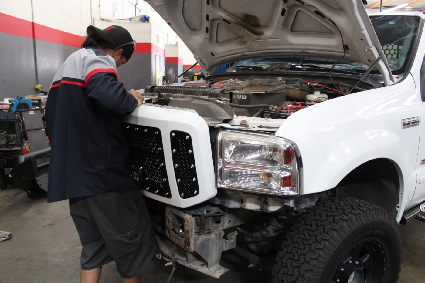 16. Once assembly is complete, reinstalling the grille assembly is a simple matter. The grille can be installed with the factory bumper in place, but removing it will make the job much easier. If you have an aftermarket bumper, removal will most likely be mandatory.