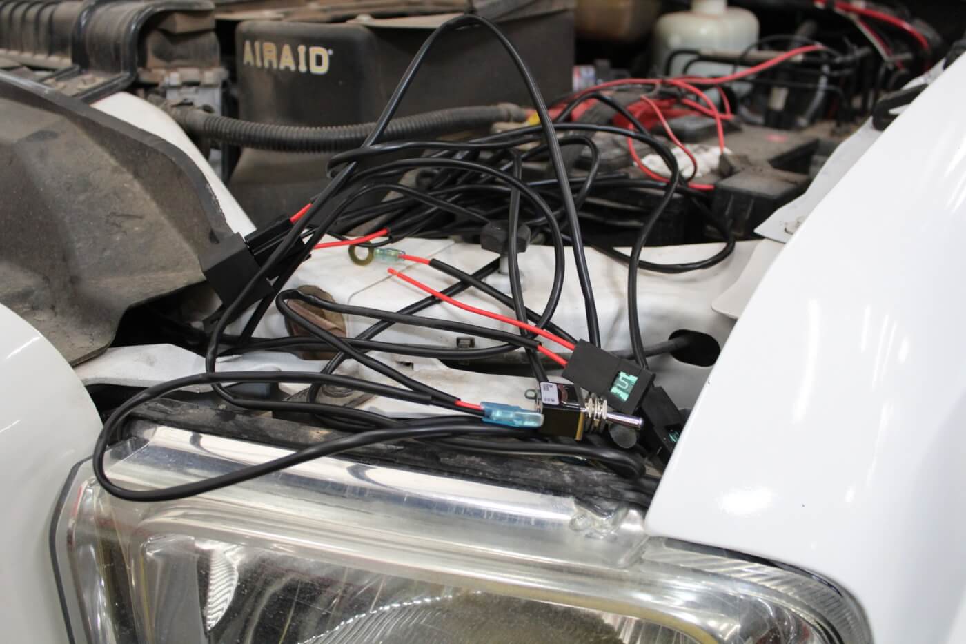 17. The Incredible RC1X grille includes a simple wiring harness to wire up the LED light bar. Though it looks a bit jumbled up here, installation was a simple matter of routing the wiring into the cab and hooking it up to a power source. Wiring installation took about 15 minutes.