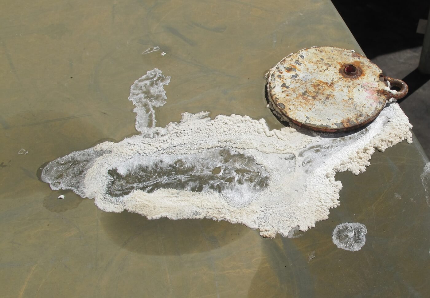 11. Urea crystals form as the water in DEF evaporates. Seen here is a DEF spill. These crystals are death to your high-pressure injectors—they have the same effect as running sand through the fuel system.