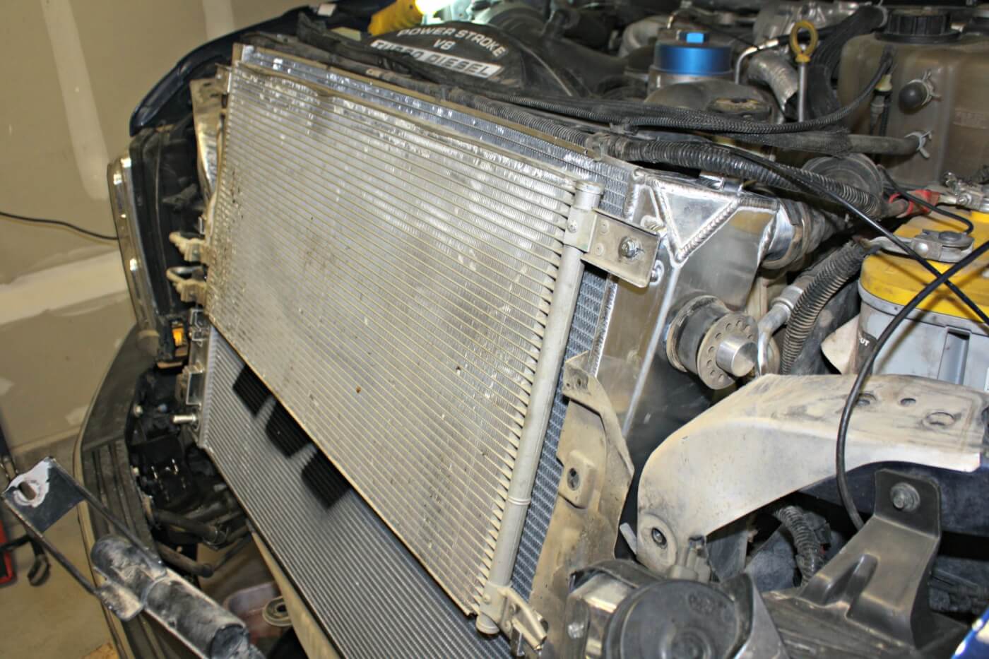 16. With the help of a friend the new radiator can be installed in the truck; reassembly is the reverse of disassembly.