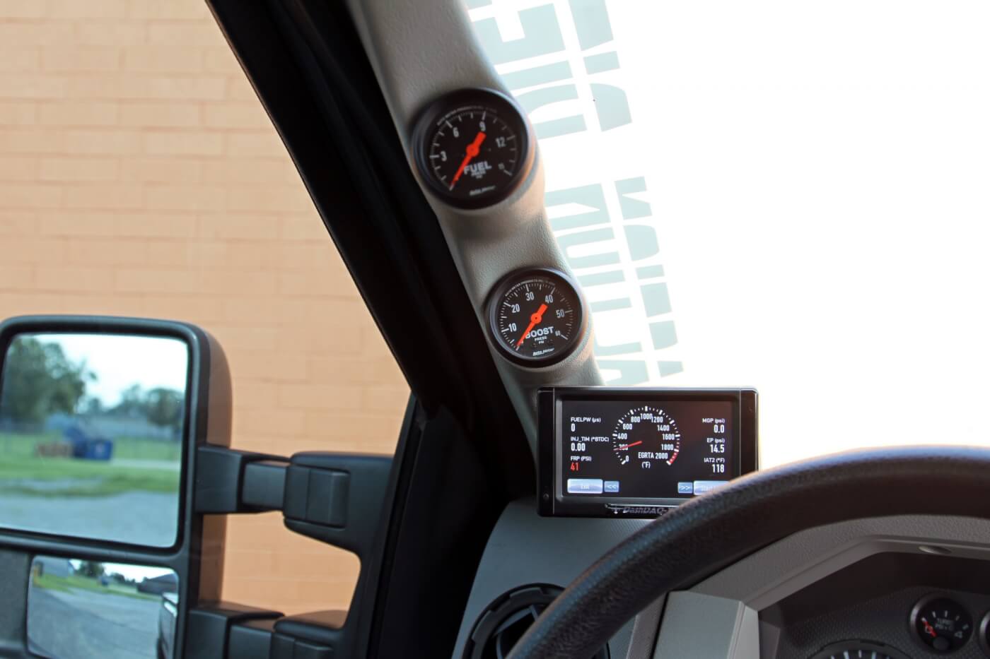 A-pillar-mounted DashDAQ monitor and Auto Meter boost and fuel pressure gauges give Lindenberg all the engine information he needs at a glance.