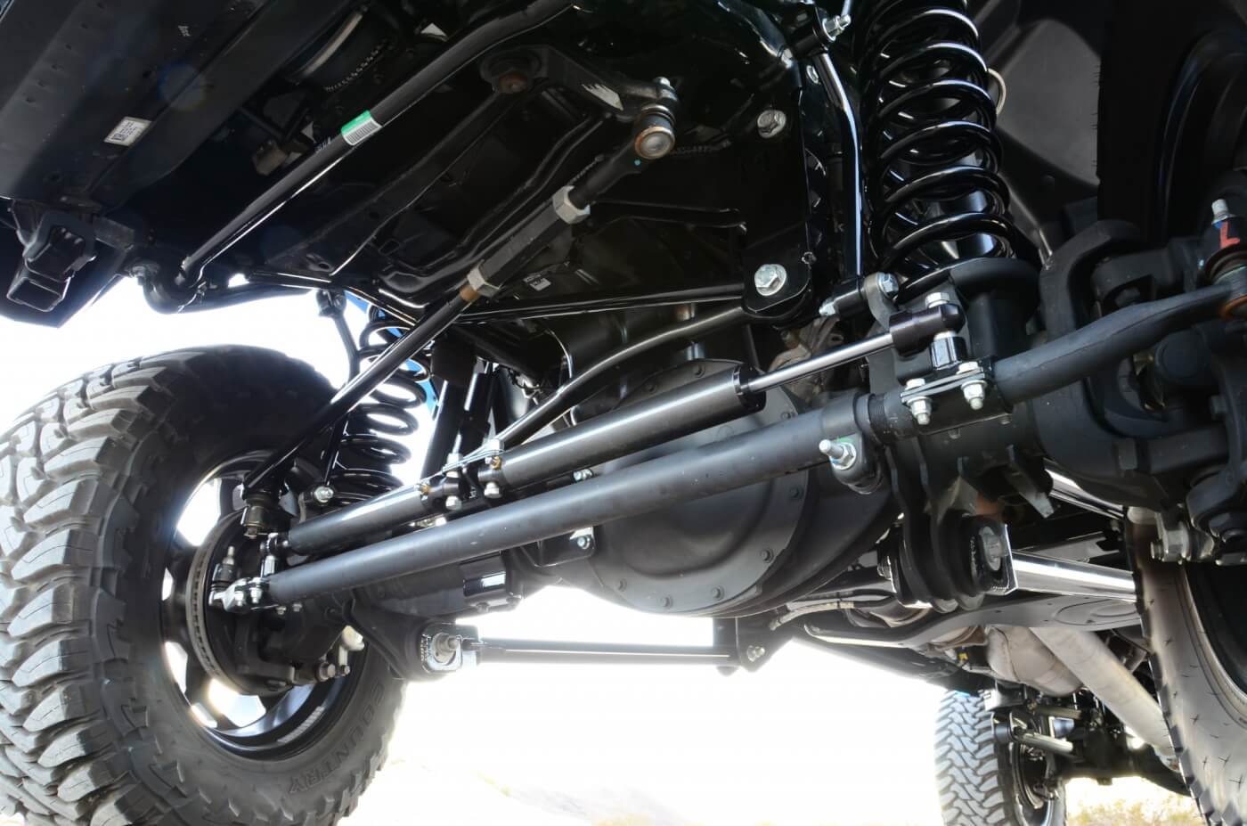 Cross-over steering relocates the mounting above the knuckle, and dual steering stabilizers keep those big Toyo tires tracking straight and true.
