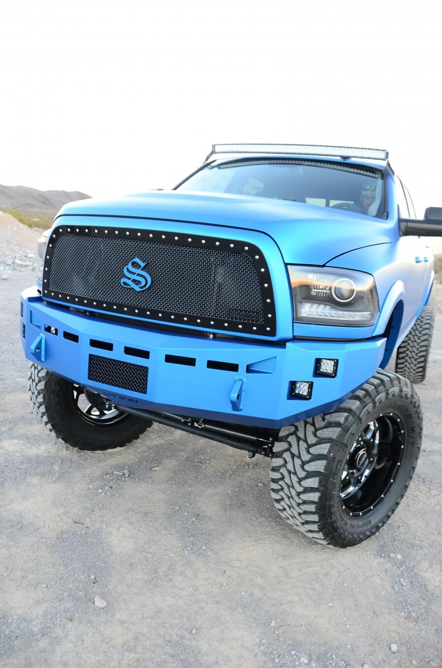 For a gnarly look up front, Matt installed a massive Fusion bumper with recessed LEDs, plus a mesh from Status Grilles with low-profile spikes and a color-matched center emblem.