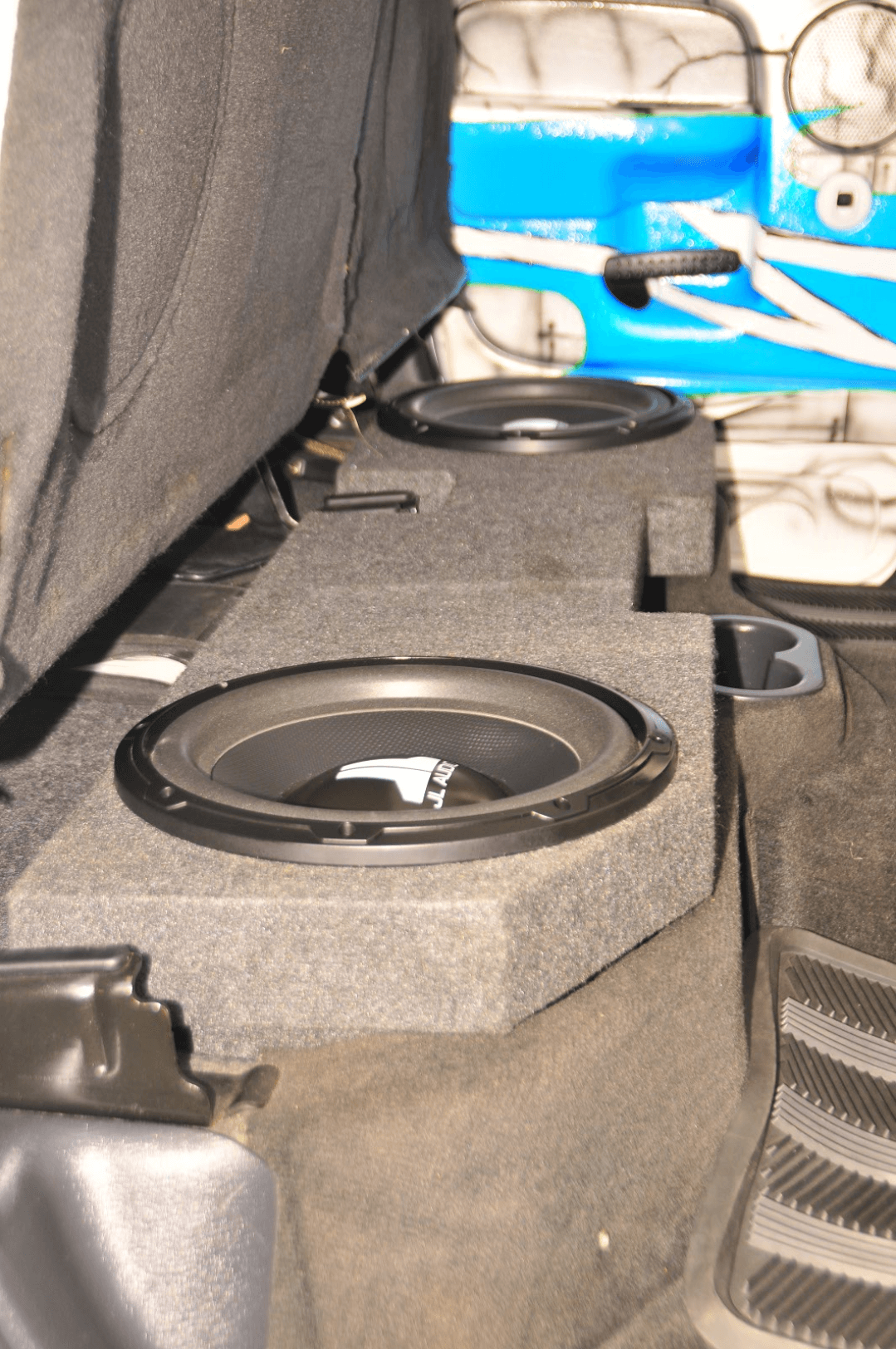 Subwoofers are located in a box under the rear seat.