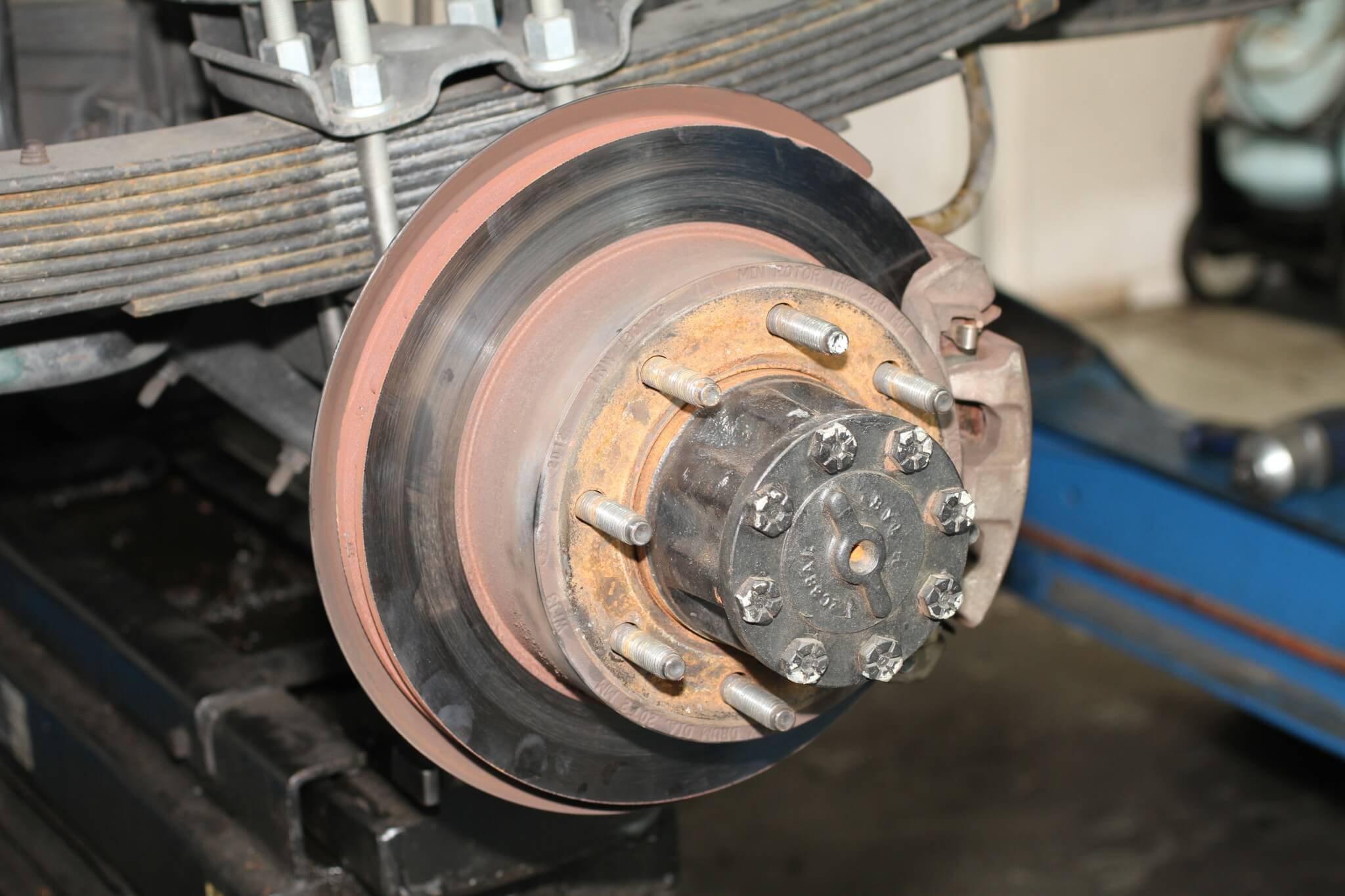 9. Here you see the rear caliper on this single rear wheel F-350. As with the front, the caliper and pads come off and then the rotor is removed. 