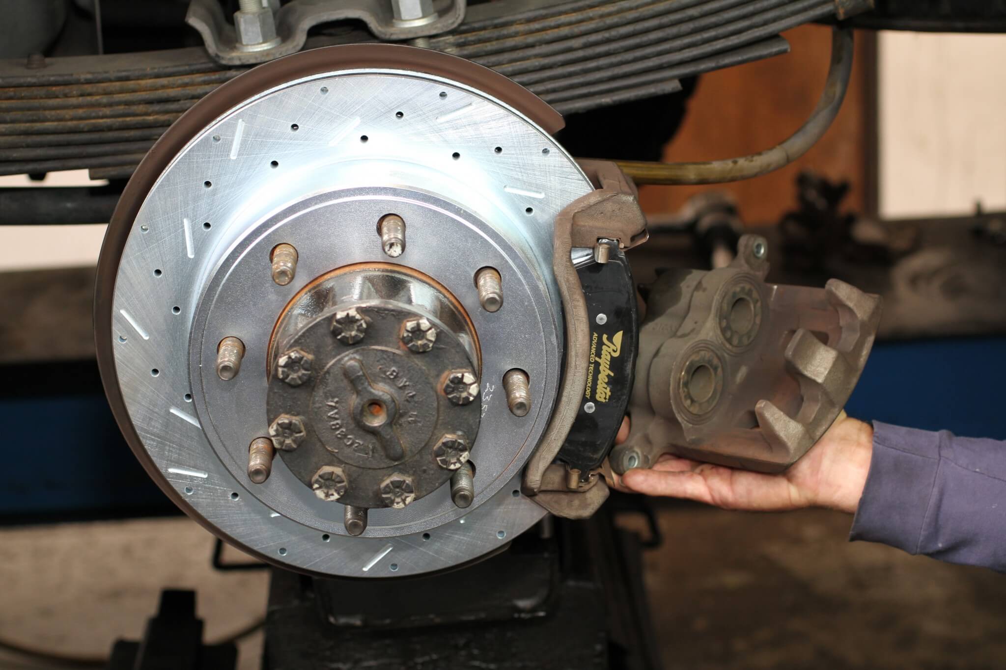 12. The stock rear calipers are reused. SSBC offers upgraded rear brake pads that fit the OEM calipers, and offer better stopping power than you’ll get from budget auto store replacement pads. 