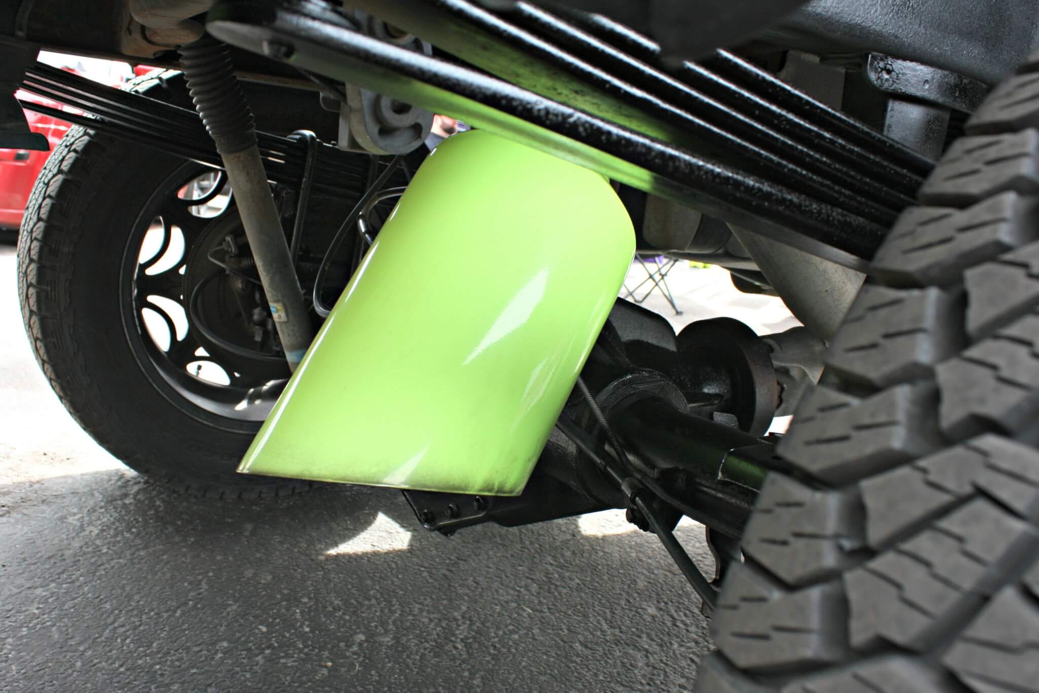 We found this at the No Limit Powder Coat booth on vendor’s alley. Their lifted Duramax was sporting monstrous neon green over the axle dump exhaust system. Here you can see the tip. This is something pretty unique but very fitting for the owner’s line of work.