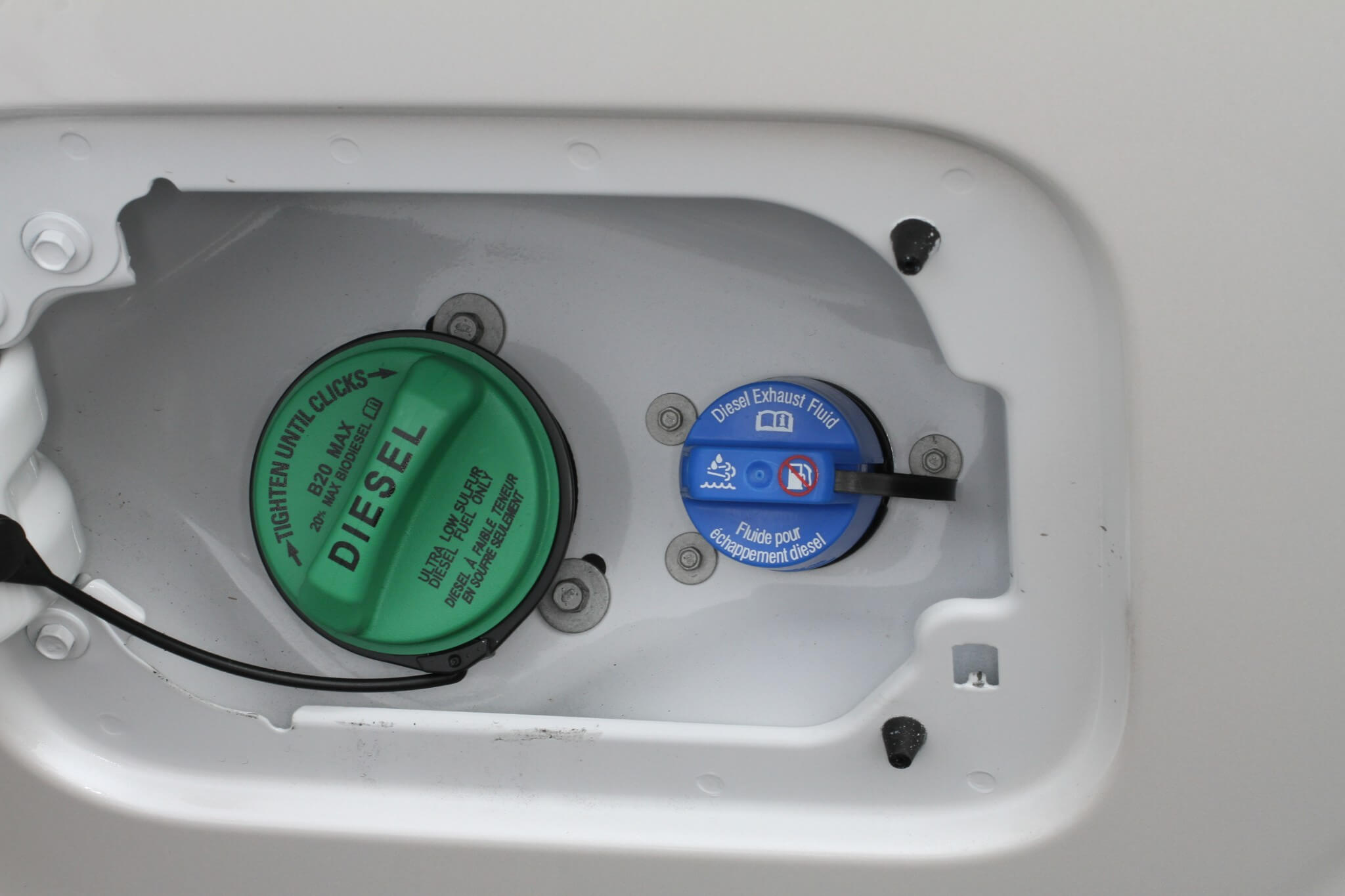 7. The DEF fill location is different between models and brands. The fuel and DEF fill are both located in the fuel door on this Ford pickup. While diesel fuel caps can vary in color, green is the most common. DEF fill caps are typically blue.