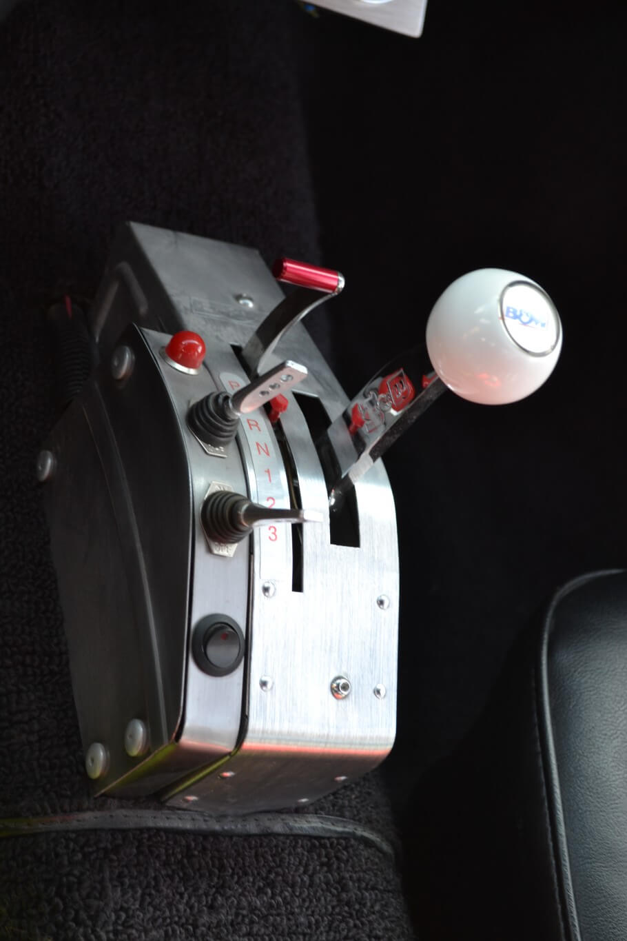 There's a lot going on around the B&M Pro Ratchet shifter − A panel controls, lock-up, overdrive, and the transbrake.