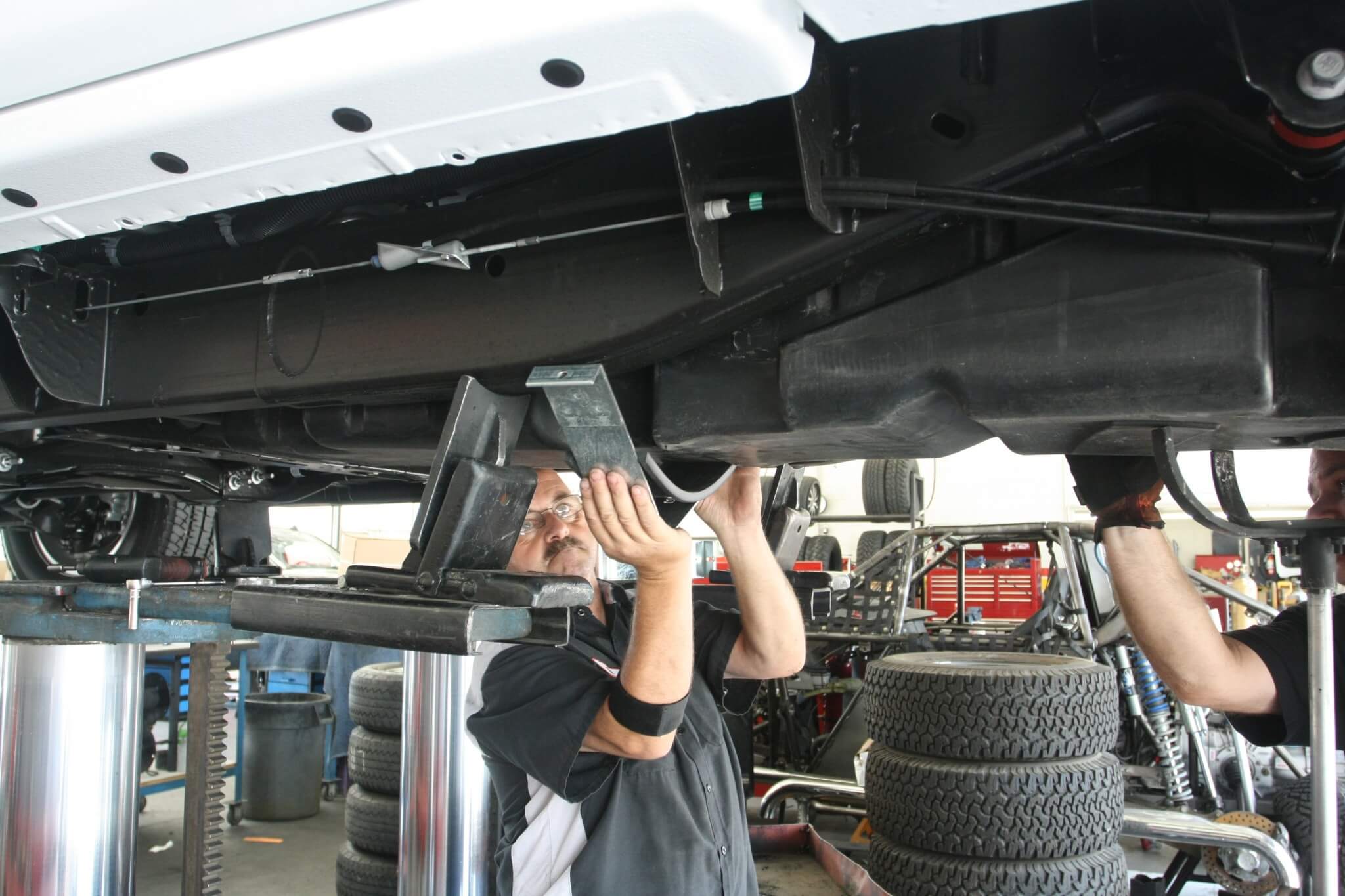 17. The tank straps are installed, but know that the longer one goes to the rear while the shorter one goes up front. 