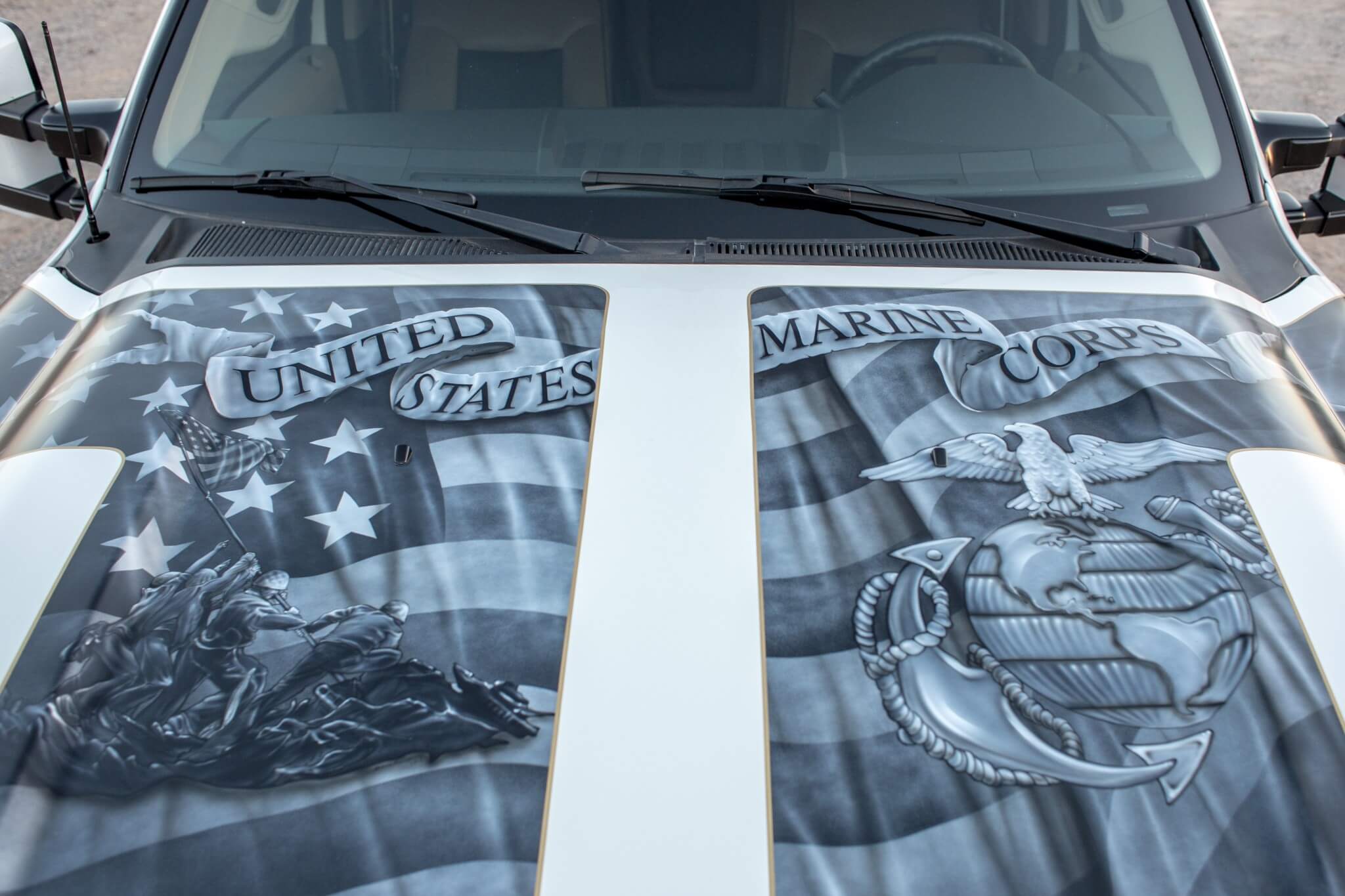 CR Designs helped this truck pay homage to the USMC as the hood features iconic symbols airbrushed over an American flag.